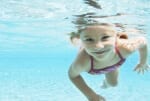 young girl swimming