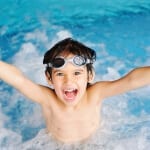boy swimming in pool