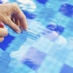 Analyzing of a water from swimming pool, taking water sample to