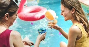 Relaxing pool party with clean, crystal-clear water using Clear Comfort AOP water treatment system and low-chlorine pool water care