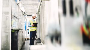 Cooling tower with poor water treatment leading to biofilm, scaling, and high operational costs.