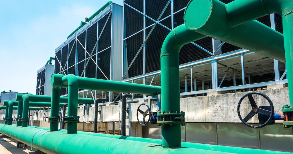 Sustainable AI data center cooling towers with low WUE and PUE environmental impact.