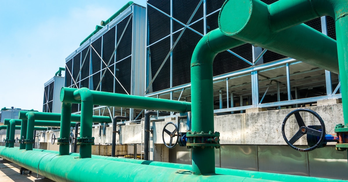 Sustainable AI data center cooling towers with low WUE and PUE environmental impact.